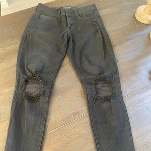 Mid rise black ripped jeans